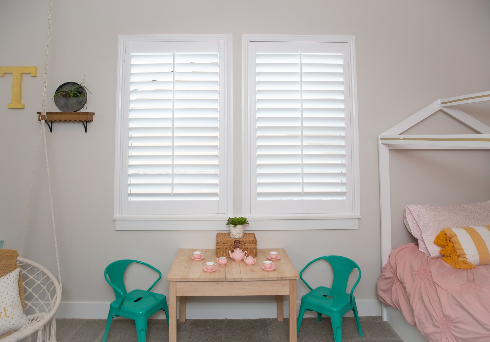 White plantation shutters in a kids' bedroom