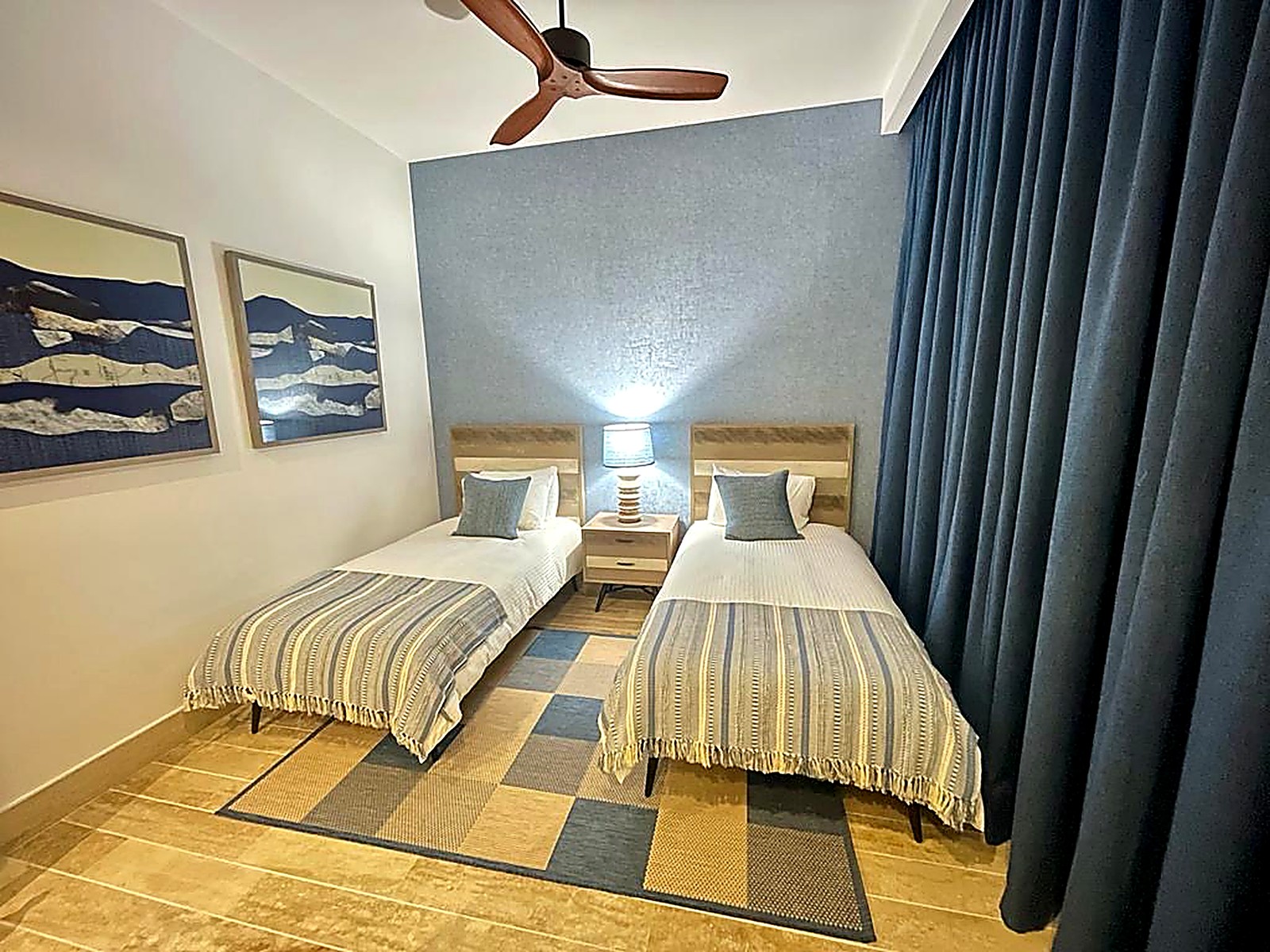 Navy curtains in a twin bedroom